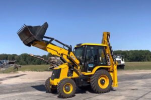 Backhoe loader with reinforced boom performing excavation