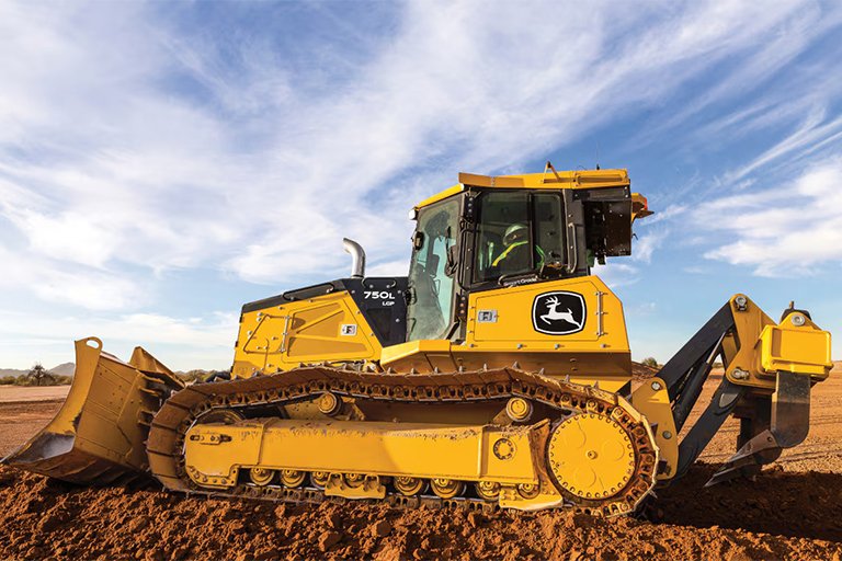 Heavy-duty bulldozer pushing soil at construction site