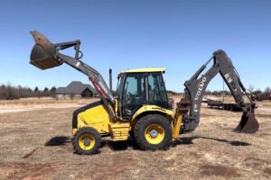 Industrial-grade backhoe loader designed for deep trenching and loading tasks