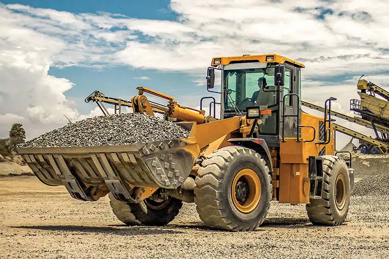 Wheel loader transporting gravel at a construction site
