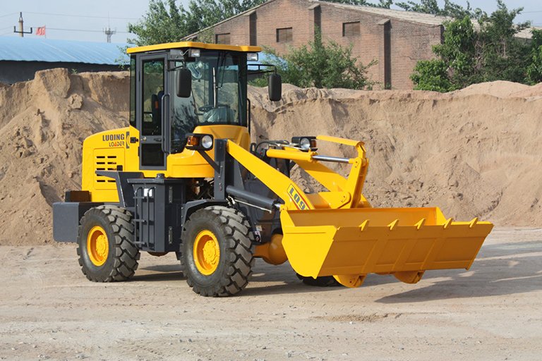 Front wheel loader with shovel bucket loading construction materials