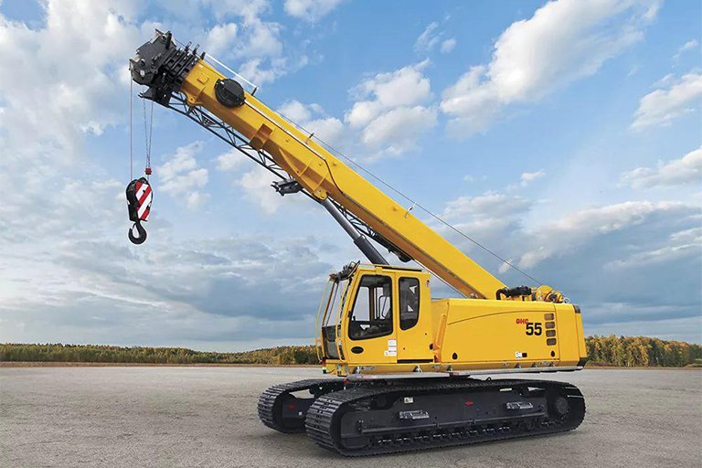 Crawler crane lifting heavy load on construction site