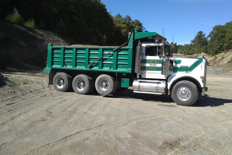 Dump truck transporting construction materials on site