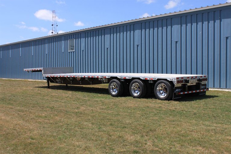 Step deck trailer with double-level deck for heavy equipment transport